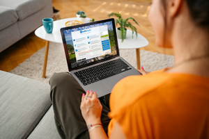 Woman using her laptop to view MyBellinHealth patient portal