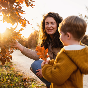 Mother and son smiling in autumn