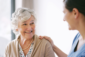 Happy senior woman talking with her provider