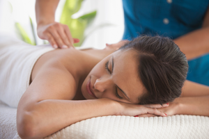 Relaxed woman at massage therapy session