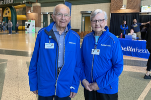 Two senior volunteers at Bellin Health event