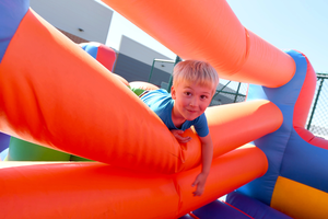 Young boy in bounce house at Bellin Village